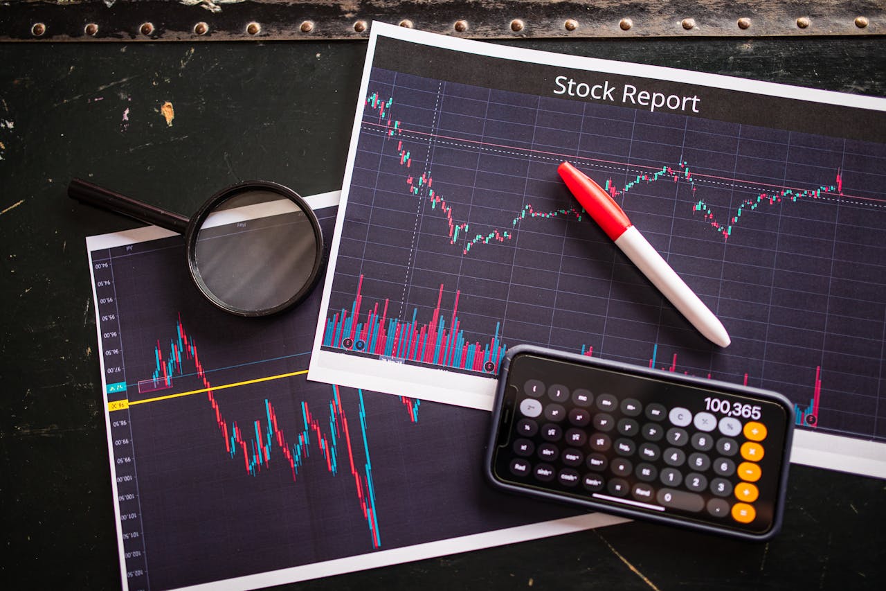 services-01 Stock report with charts, calculator, and magnifying glass for financial analysis.